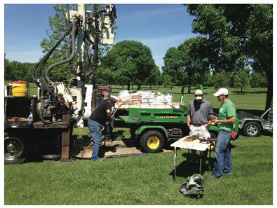 Installing water monitoring wells on an Iowa golf course