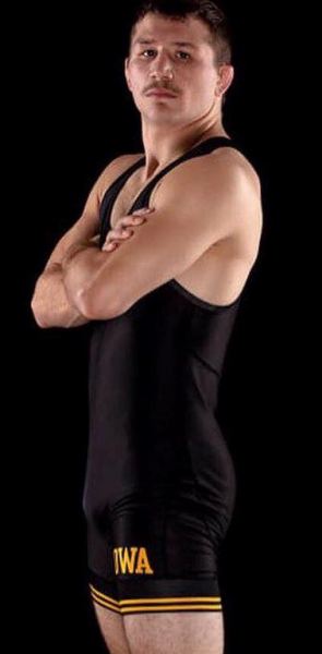Wrestler Jeren Glosser stands in front of a black background