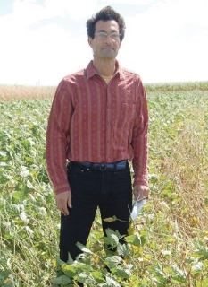 Matt Liebman stands in a field