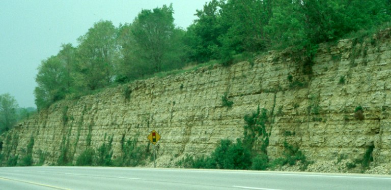 Limestone rock enters Iowa streams as soluble calcium bicarbonate.