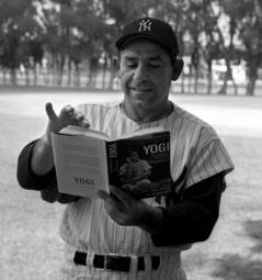 Yogi Berra reading a book about himself