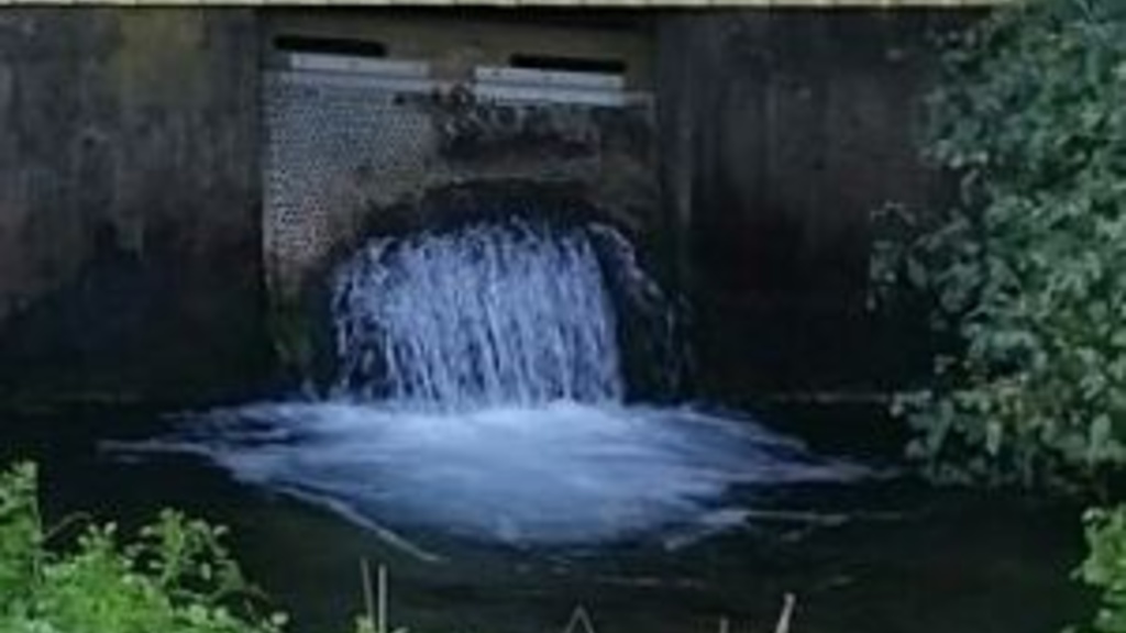 Water flows from a wall into a stream