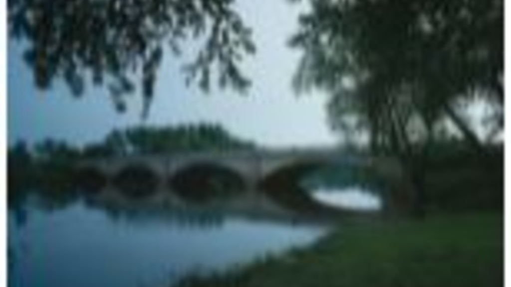 A bridge across the Wapsipinicon River at dusk