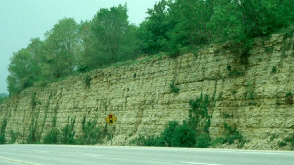 Limestone rock enters Iowa streams as soluble calcium bicarbonate.